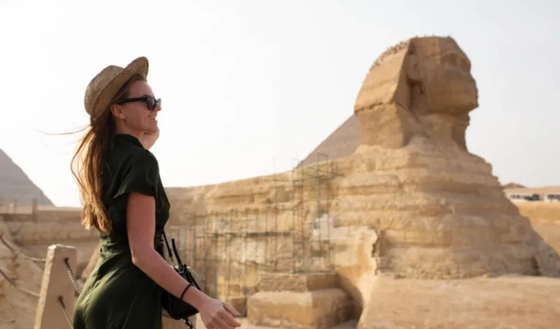 A young woman in front of the Sphynx, Egypt Tour