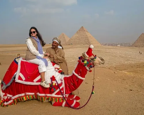 Camel in Santa Claus hat, Egypt Christmas Tours 
